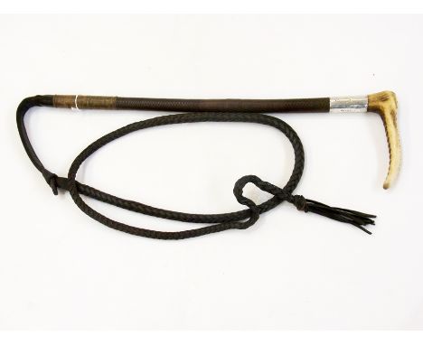 Hunting crop with carved horn handle, the silver collar dating 1915, with leather thong 
