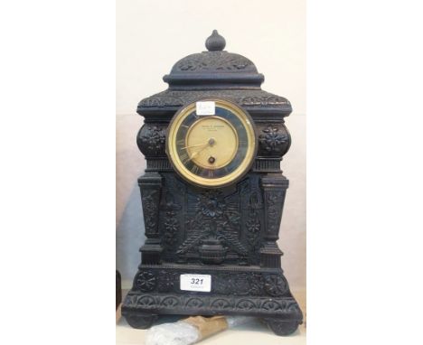 Victorian cast-iron mantel timepiece by Spaul & Johnson, Ludgate Hill, London, the caddy top with gadrooned finial, ornate fl