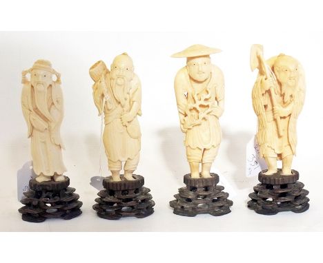 A set of four Japanese carved ivory figures, men with accompanying tools of their trade such as fish and basket, hoeing type 