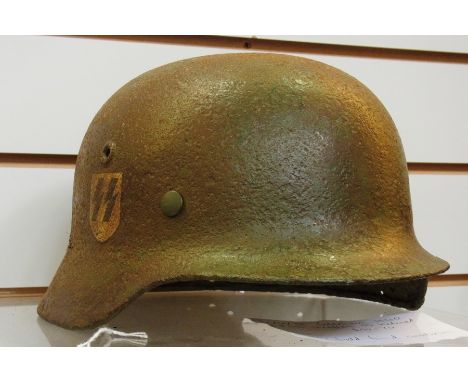 A WWII M40ET62 Waffen SS helmet 