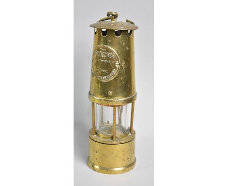 A Brass Miners Safety Lamp by the Protector Lamp and Lighting Company, 27cm High