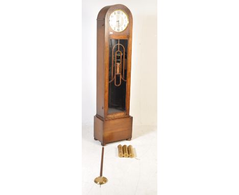 A 1930’s Art Deco Enfield Westminster chiming longcase clock having silvered dial with Arabic number chapter dial and Breguet