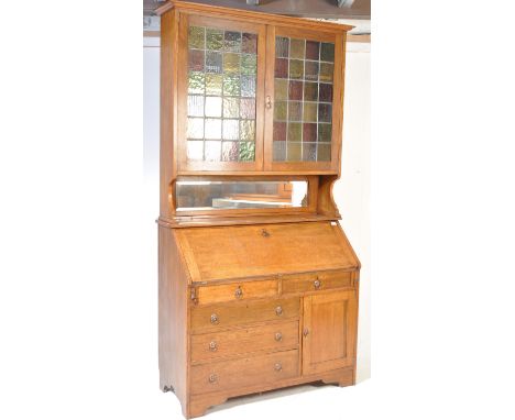 A vintage 20th century dome top chest / steamer trunk having wooden banding with metal studs. The chest has a hinged lid open