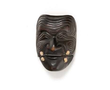 A JAPANESE WOOD MASK NETSUKE OF SANKA JOMEIJI ERA, 19TH CENTURYIn two parts linked by cord, the face with deep lines on its f