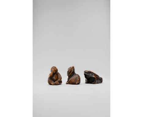 THREE JAPANESE NETSUKE OF ANIMALS EDO/MEIJI, 18TH/19TH CENTURY   One carved as a large frog, its eyes inlaid with metal studs