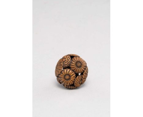 A JAPANESE WOOD RYUSA NETSUKE MEIJI ERA, 19TH CENTURYThe surface decorated in openwork with chrysanthemum, daisies and other 