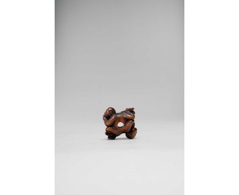 A JAPANESE WOOD NETSUKE OF MONKEYS EDO OR MEIJI, 19TH CENTURY  Cleverly carved as four monkeys with two heads: one pair seate