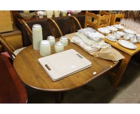 An Ercol drop leaf dining table with a set of four chairs 