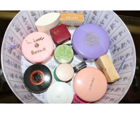 A collection of sealed vintage dusting powders in original packaging 