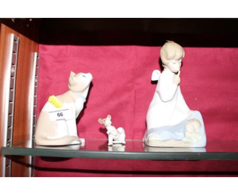 A Nao cat ornament; a small dog ornament similar and a Lladro figure group