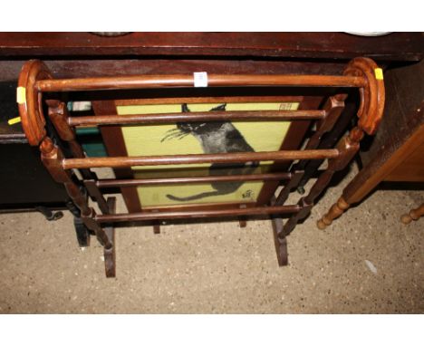 A wooden towel rail; and a firescreen inset with a needlework depicting a cat 