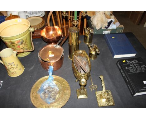 A quantity of various brass and copper to include two blow lamps, a chamber stick, toasting fork, WW1 shell, a candelabra, co