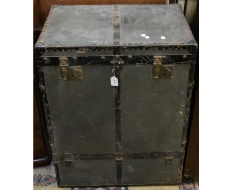 A metal bound travelling trunk, bearing Moritz Madler label, the studs monogrammed 'MM', 86.5cm high
