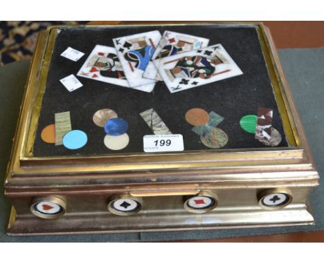 A gilt metal and pietra dura playing card box, the hinged cover enclosing four sectioned compartments, 33cm wide