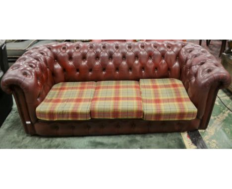 An oxblood Chesterfield type three seater office/reception sofa, 200cm wide