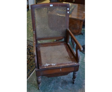 A Leveson and Son metamorphic commode chair, bergere back and seat cover, c.1880