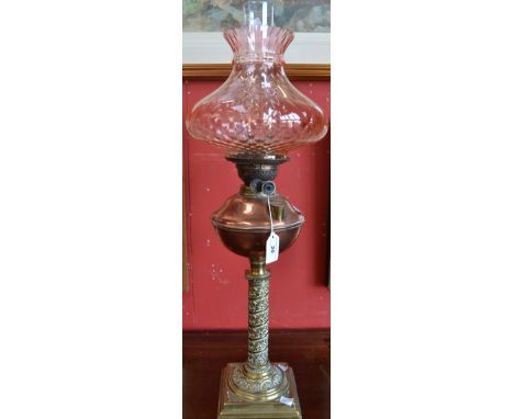 A late Victorian copper and brass oil lamp, fluted apricot shade, approx overall height 70cm