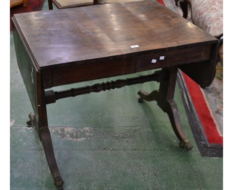 A George III mahogany crossbanded drop leaf sofa table, brass lion paw feet, 151cm wide, c.1810