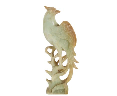 Chinese Celadon Jade Bird on a Branch. Late Qing dynasty. The exotic bird, with long tail feathers, and shaped wings, its hea