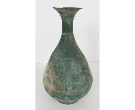 Dating from 918 through 1395 CE. The underside with a paper label with the number8477.09. The thin-walled pear-form body with