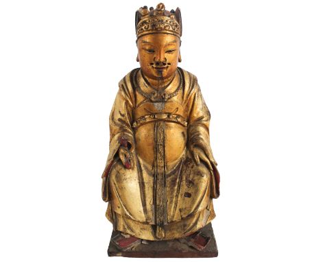 Chinese Gilt Lacquered High Ranking Official. Qing/late Ming Dynasty. The young man gazing forward with upright posture, dres