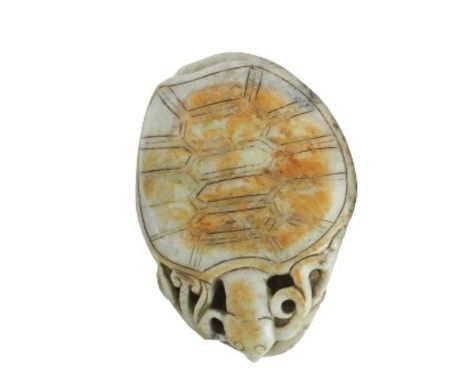 Chinese Jade Study of a Turtle Atop a Lily Pad The turtle foraging on foliage, the speckled white jade with surface tones of 