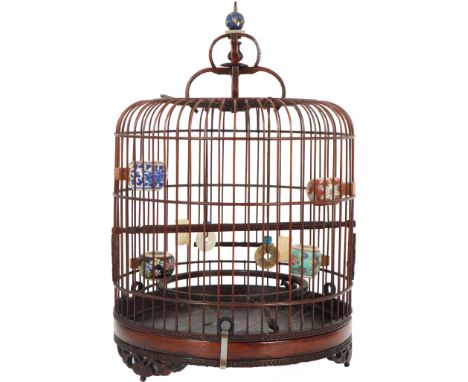 A 1940s Chinese Wicker Bird Cage with Decorative Ceramic Feed Bowls and Stone Carved Ornaments. A charming item in very good 