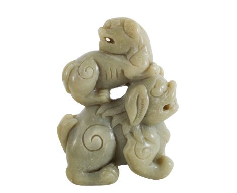 Chinese Celadon Jade of Frolicking Fu-Dogs. A mother with cub, the cub atop its mothers back Size: 3 3/8 x 2 x 4 3/4 in.