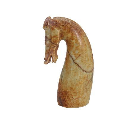 Chinese Yellow and Russet Jade Horse Head. In a Han Dynasty style, the elongated horses’ neck with a stylized cropped mane, c