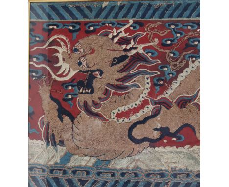 Qing Dynasty, 18th Century. Depicting a five-claw wreathing dragon in metallic thread, set against a red ground with blue clo