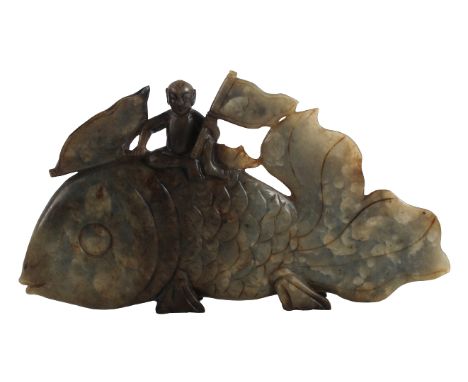 Large Chinese Gray-Green Jade Carp The fish surmounted by a seated male nude waving two banners. Size: 11 1/2 x 1 x 6 1/4 in.