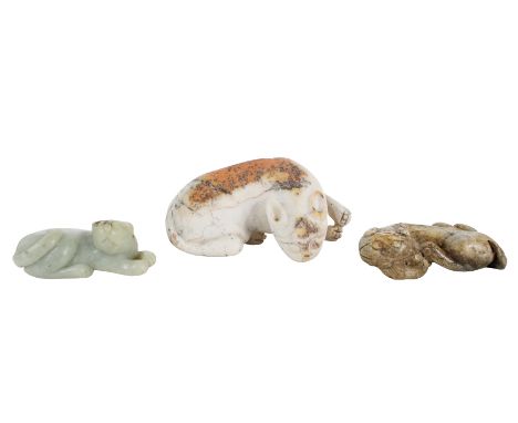 Comprising, a late Qing dynasty celadon recumbent tiger with brown inclusions, the second, a mottled part-calcified green jad