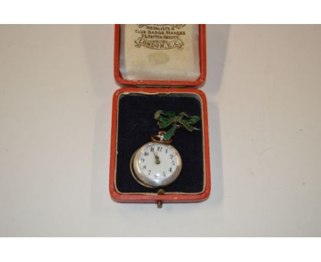 A ladies white metal and enamel decorated fob watch