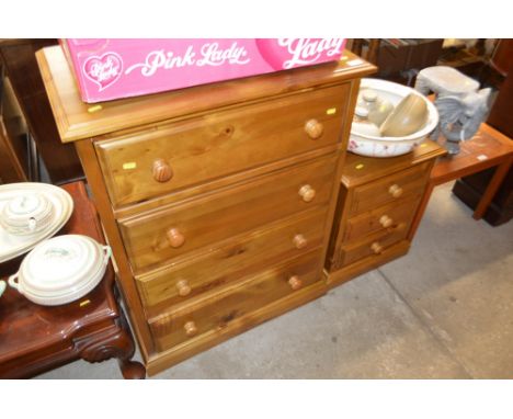 A modern pine chest fitted four long drawers and matching three drawer bedside chest 