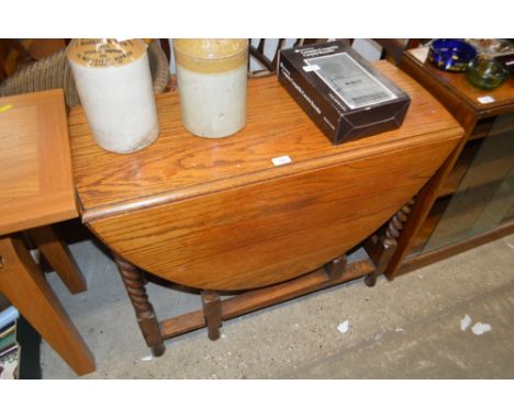 An oak barley twist gate leg table