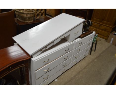 Two white painted chests of drawers and matching dressing table top