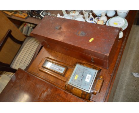 An Art Deco oak cased barometer and a painted wooden storage box