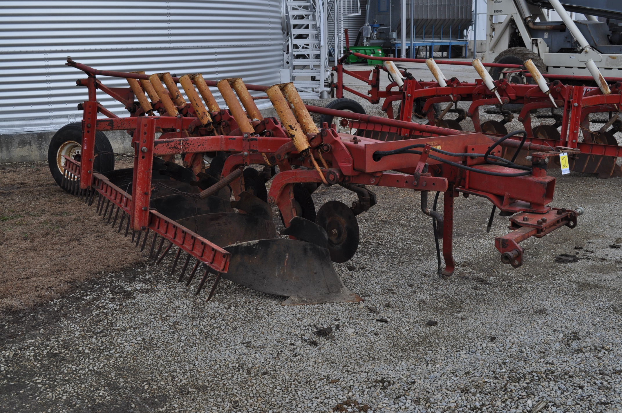 International 720 5x18 moldboard plow, auto reset, w/ buster bar harrow