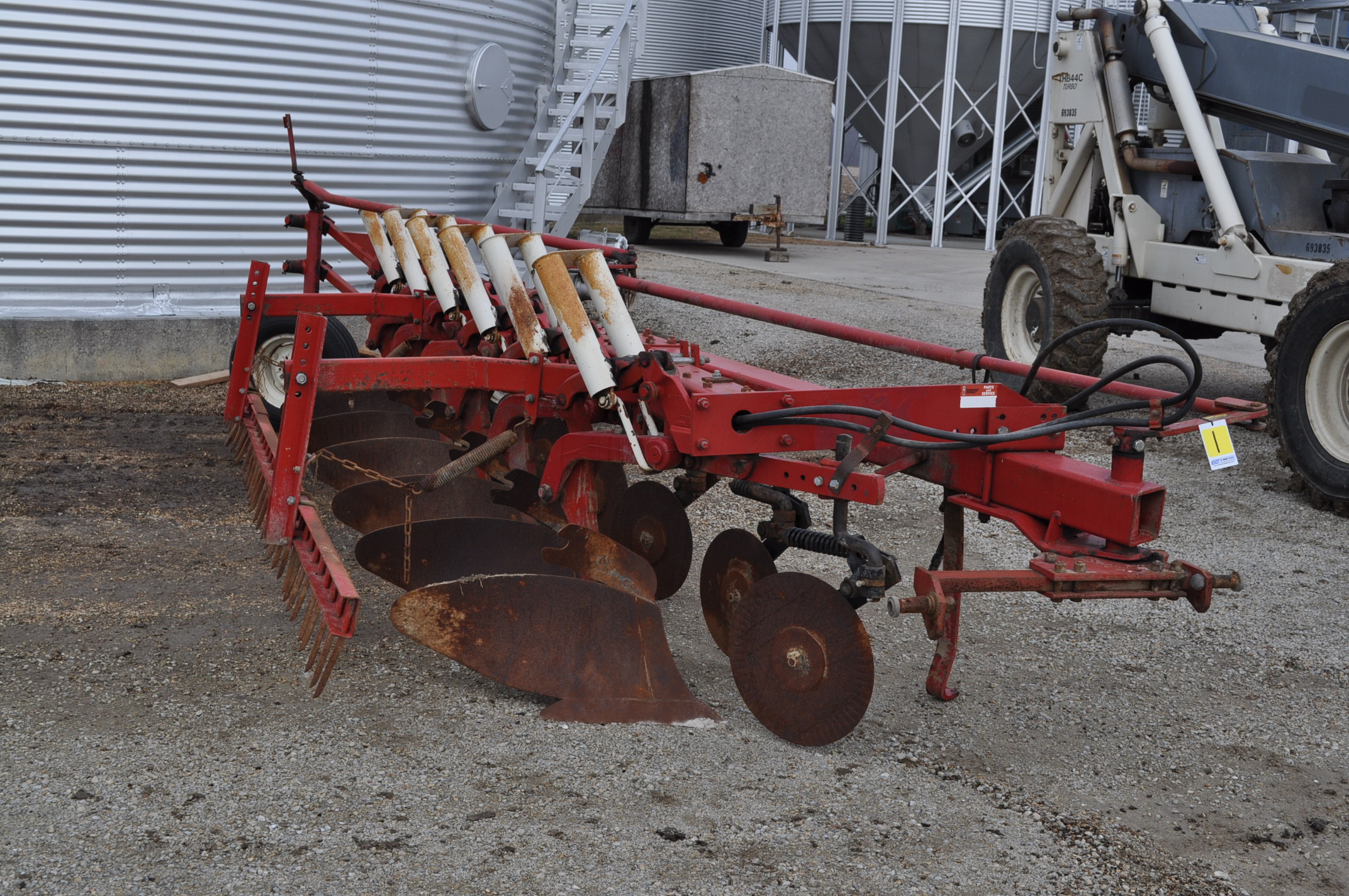 International 720 6x18 moldboard plow, auto reset, w/ buster bar harrow
