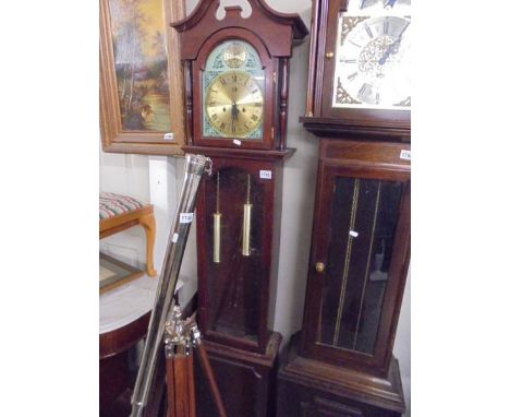 A mahogany long case clock.