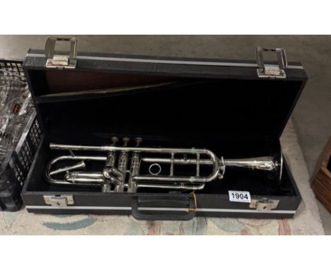 An unbranded silver plated trumpet with case