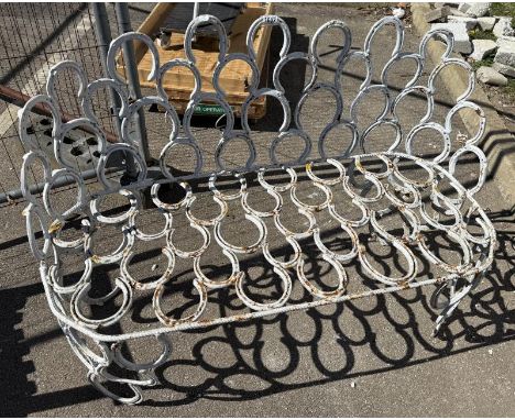 A bench made from horseshoes A/F