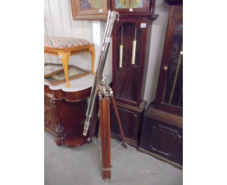 A large good quality telescope on tripod.