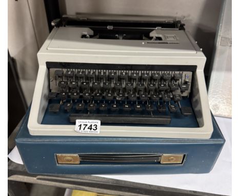 A cased Olivetti Dora typewriter.