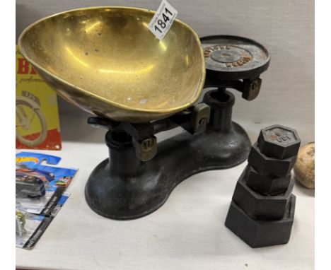 A set of cast iron kitchen scales with brass pan &amp; weights