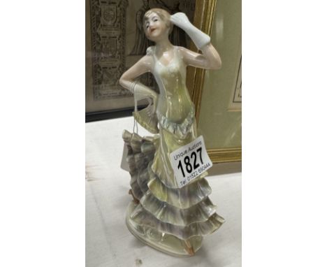 A continental ceramic figure of an art deco lady