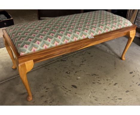 A long bedroom stool on Queen Anne legs with tapestry top