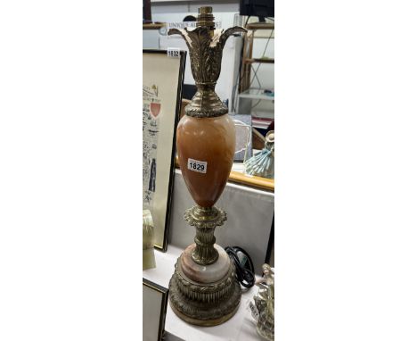 A gilded white metal &amp; onyx table lamp