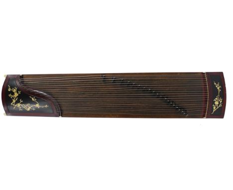 Guzheng Chinese zither harp (raft), with twenty-one strings, within a red lacquered case, with black lacquered recessed panel