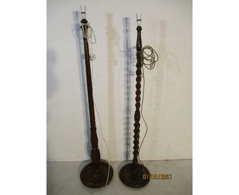 An oak barley twist standard lamp along with one other
